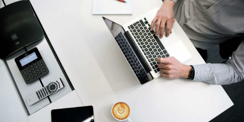 An accountant doing tax work on a laptop