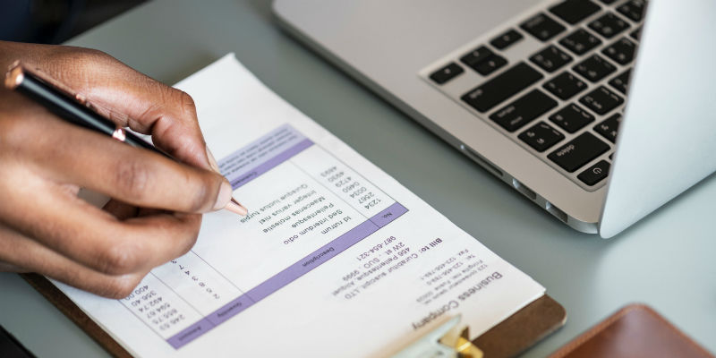 Bookkeeper organizing invoices