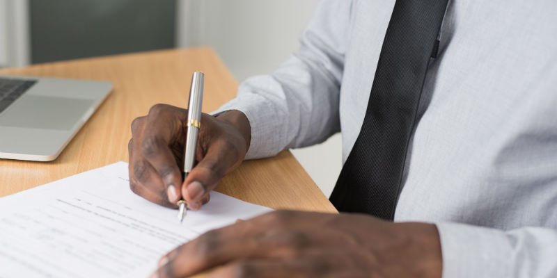 Small business owner filing paperwork