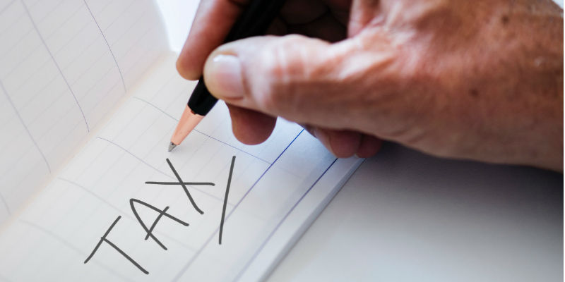 Tax written on a piece of paper