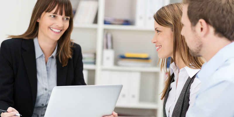 A couple speaking to an accountant