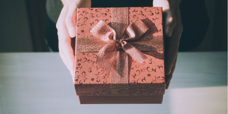 Person handing over gift