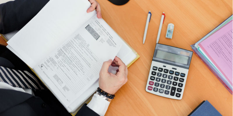 Accountant using calculator