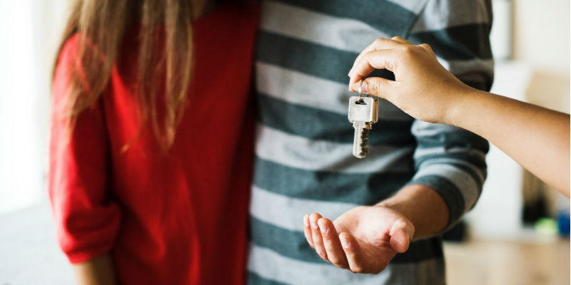 A couple picking up house keys