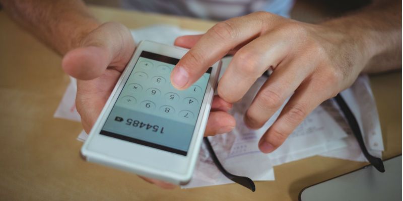 Accountant using phone calculator