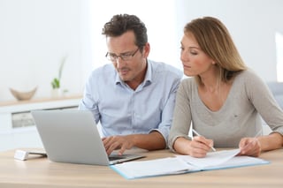 Couple at home working on laptop computer.jpeg