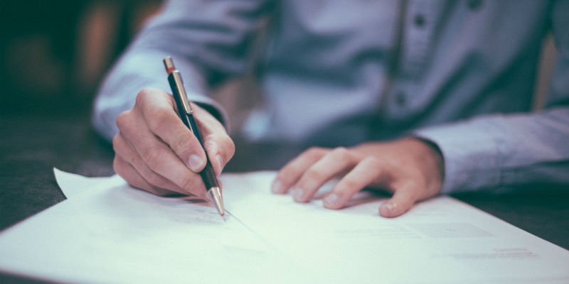 Man filling out paperwork